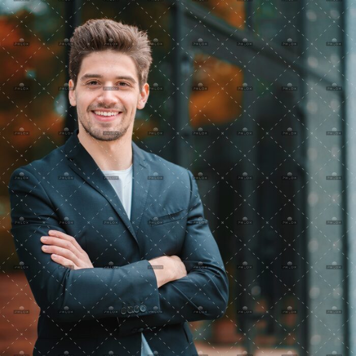 demo-attachment-356-portrait-of-young-successful-confident-businessman-in-the-city-on-office-building-background-man-in_t20_AlnLA0