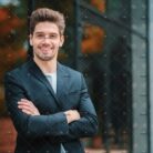 demo-attachment-356-portrait-of-young-successful-confident-businessman-in-the-city-on-office-building-background-man-in_t20_AlnLA0